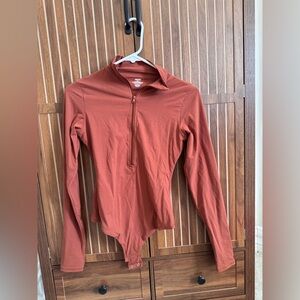NWOT Skims Fits Everybody Zip Up Bodysuit in Burnt Orange